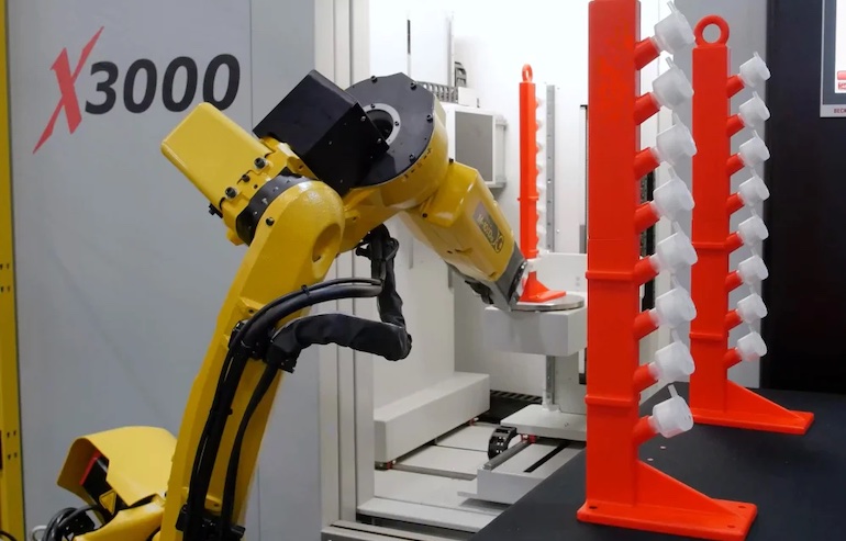 How Robotic Arms Are Revolutionizing CNC Machine Integration A CNC machine tending robot from FANUC.