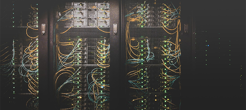 Smarter Endpoints, Zero Guesswork: How Autonomous Management Turns IT Chaos into Intelligent Automation A server room with rows of illuminated network equipment, representing the connected device infrastructure that autonomous endpoint management oversees