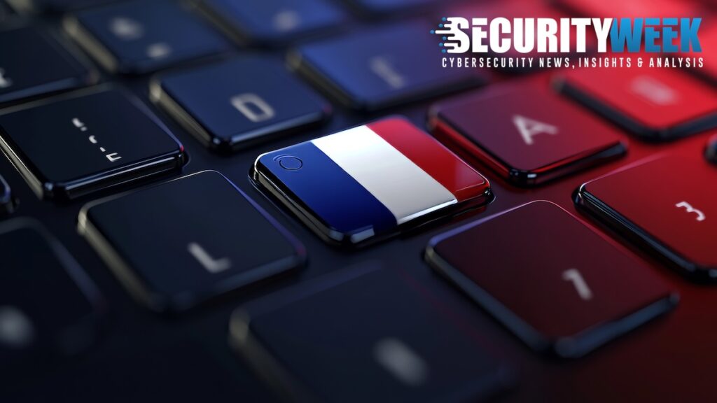 Elite French Ministry App Infiltrated by Shadowy ‘Misere’ Coder French flag on a keyboard symbolizing the breach of France's government messaging platform.