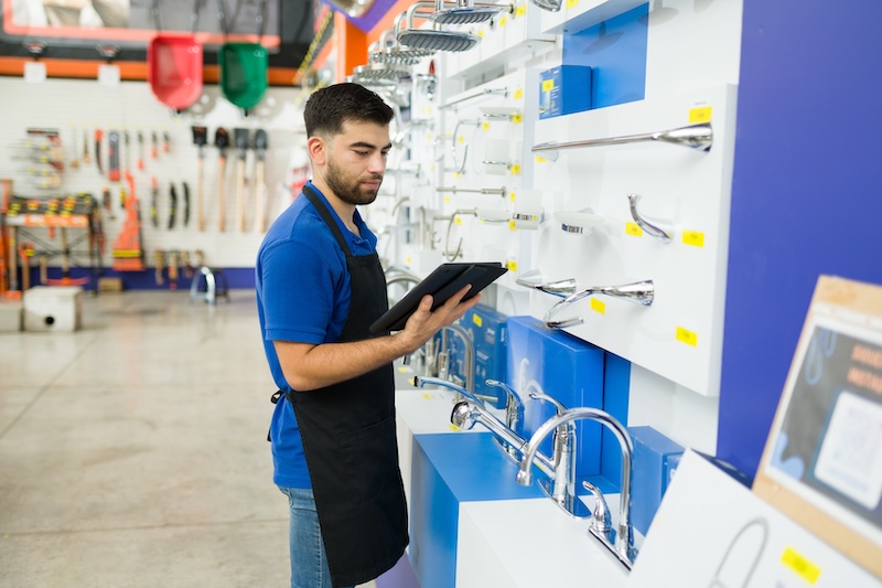 RADAR Secures $170M to Revolutionize Physical Retail with AI RADAR Raises $170M man reading from a clipboard and looking for a product or tool for a customer while working at the hardware store