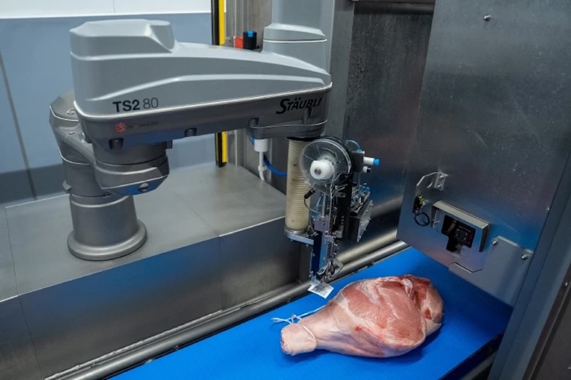 Robotic Precision: AI Breathing New Life into Serrano Ham Labels with Stäubli SCARA AI-powered robot automates Serrano ham labeling with Stäubli SCARA