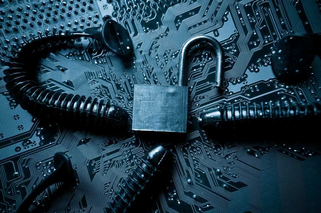 The Word Worm: A Silent Spread Through Microsoft Docs computer security breach due to worm attack - worm on computer circuit board with open security lock