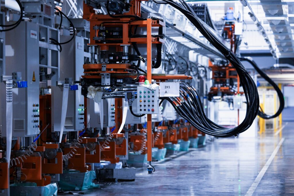 Memory Meets the Edge: The New Deciding Factor in Computing Industrial control cabinets and cabling along an automated production line, the hardware layer where edge computing nodes are installed.